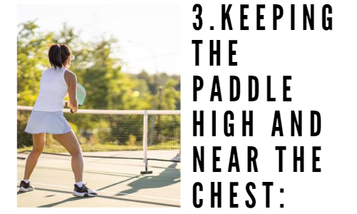 Woman holding pickleball paddle chest high and the text keeping the paddle high and near the chest